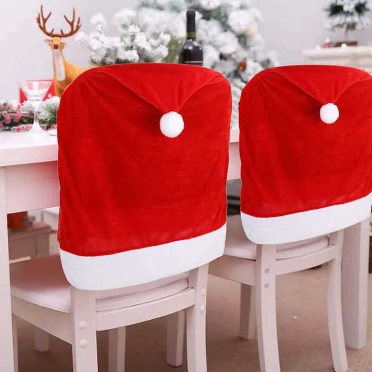Sillas con fundas de Navidad de gorro de Papá Noel.