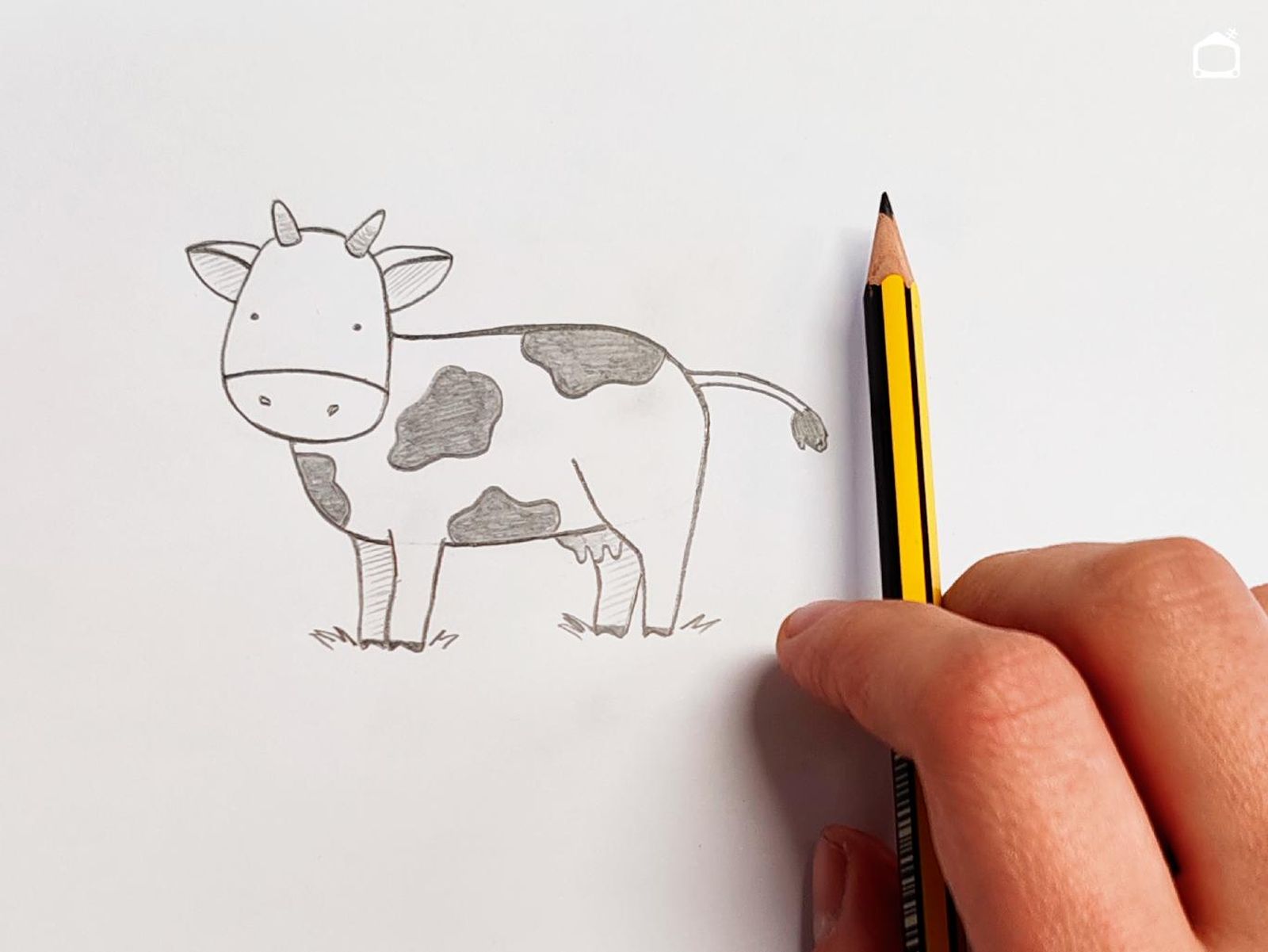 Dibujo de vaca en estilo infantil.