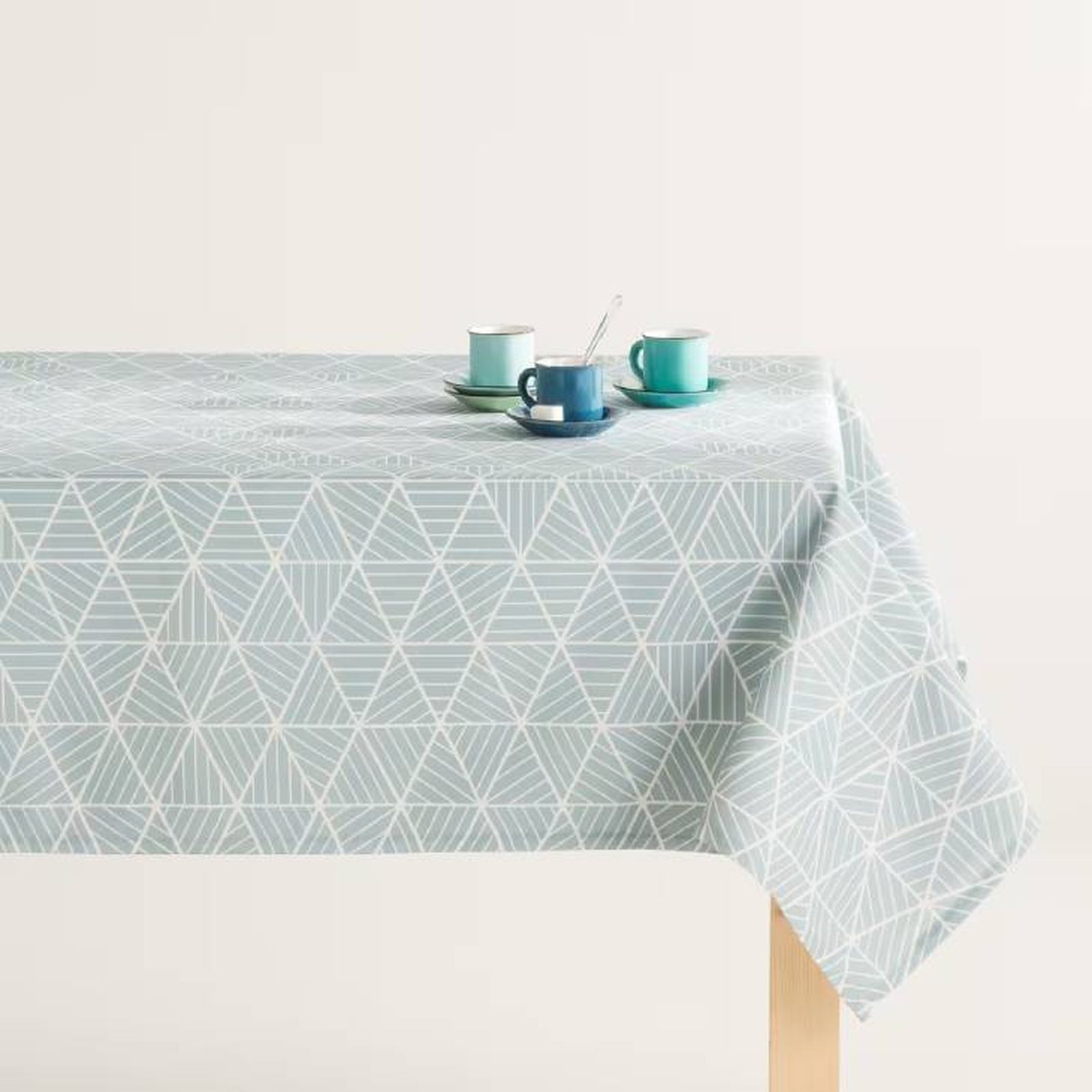 Mantel antimanchas azul con estampado geométrico Bermudas.