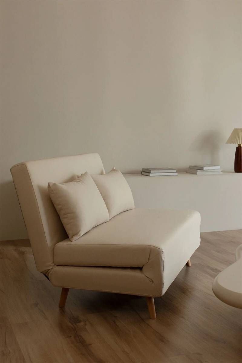 Sofá cama Elen de tela beige.