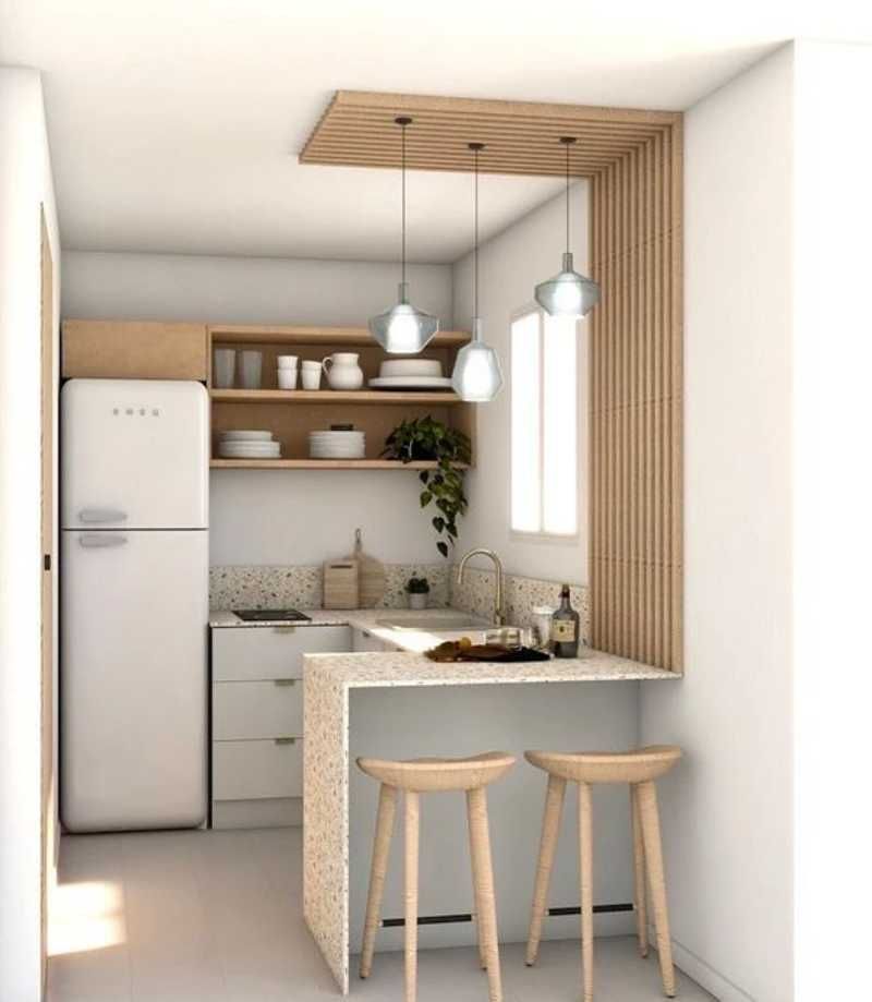 Mini cocina en tonos claros.