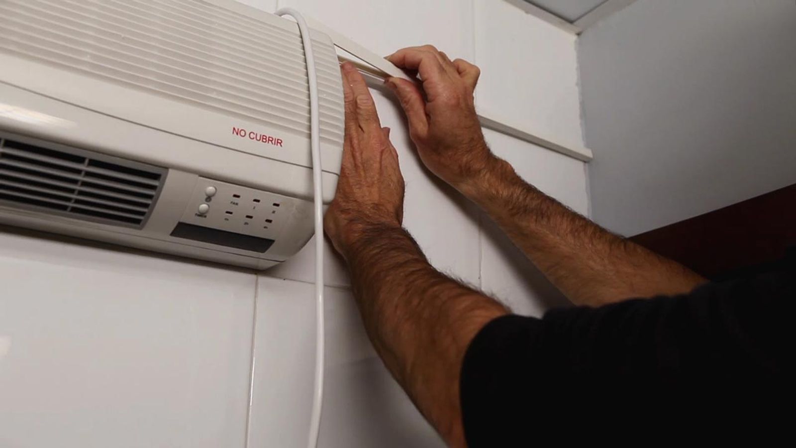 Cómo instalar un calefactor eléctrico de pared paso 10