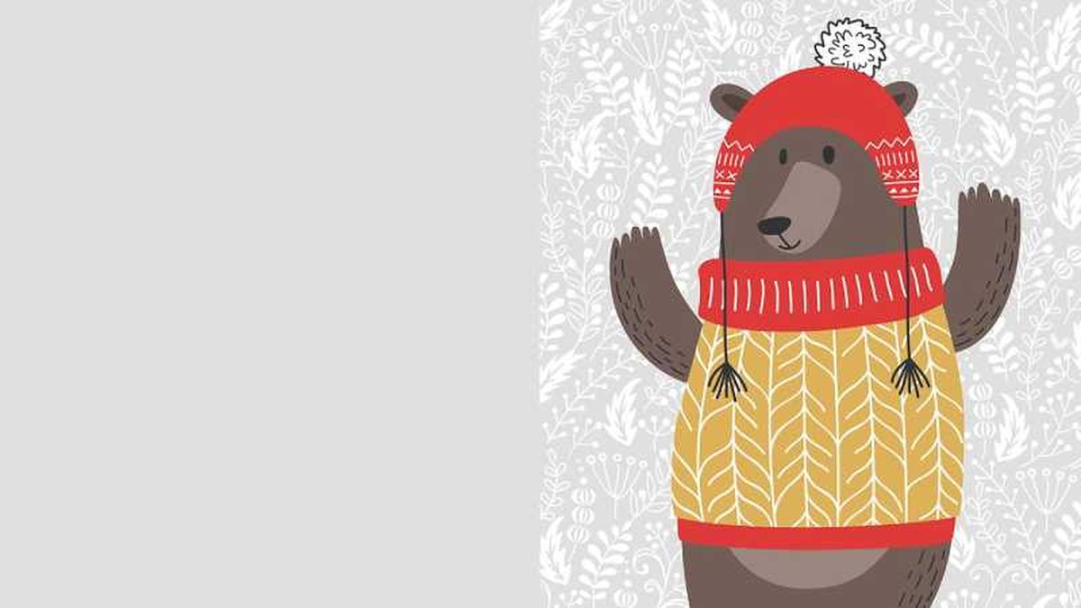 Postal navideña de oso con jersey.