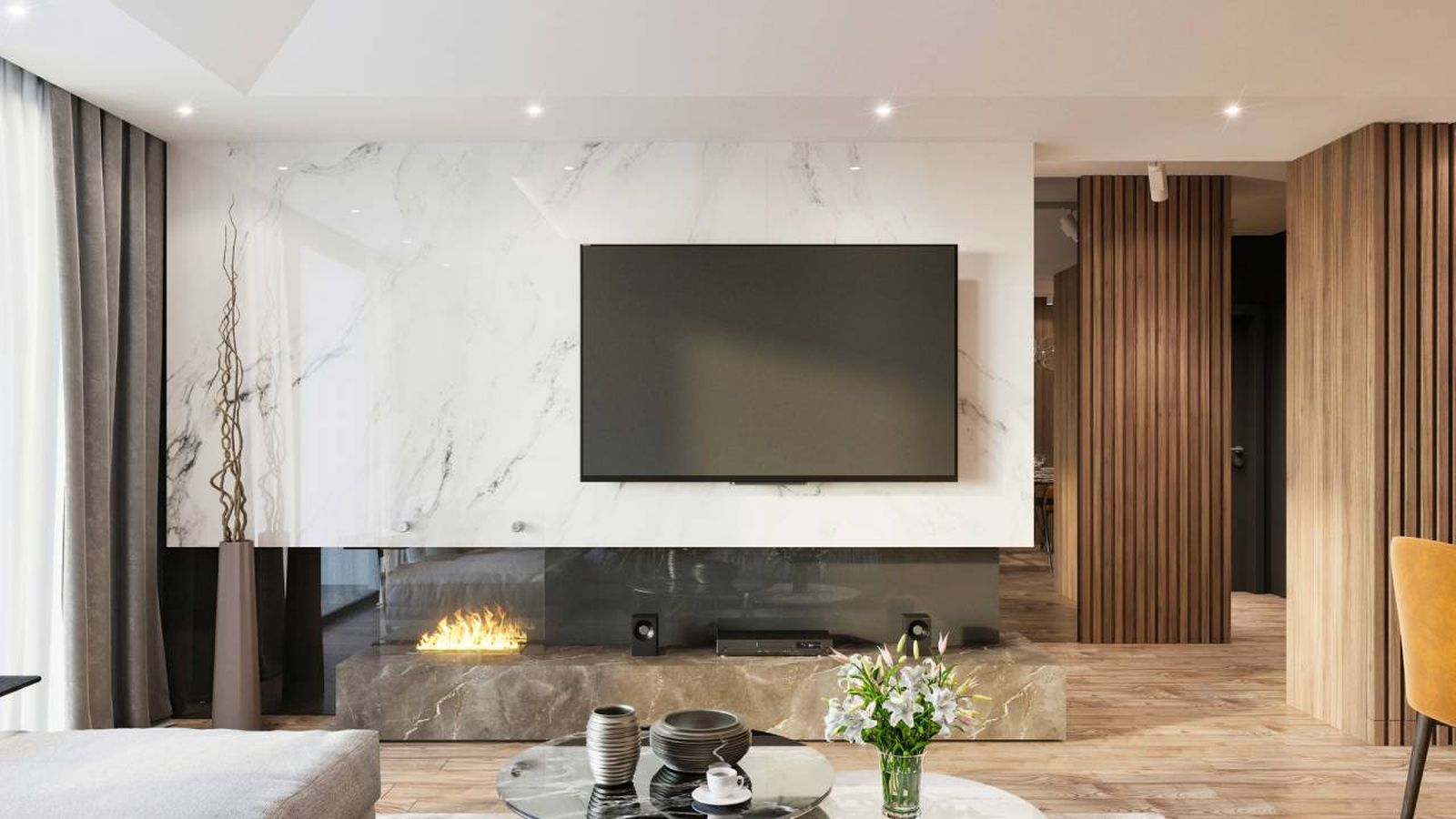 Televisión en un salón con pared de mármol.