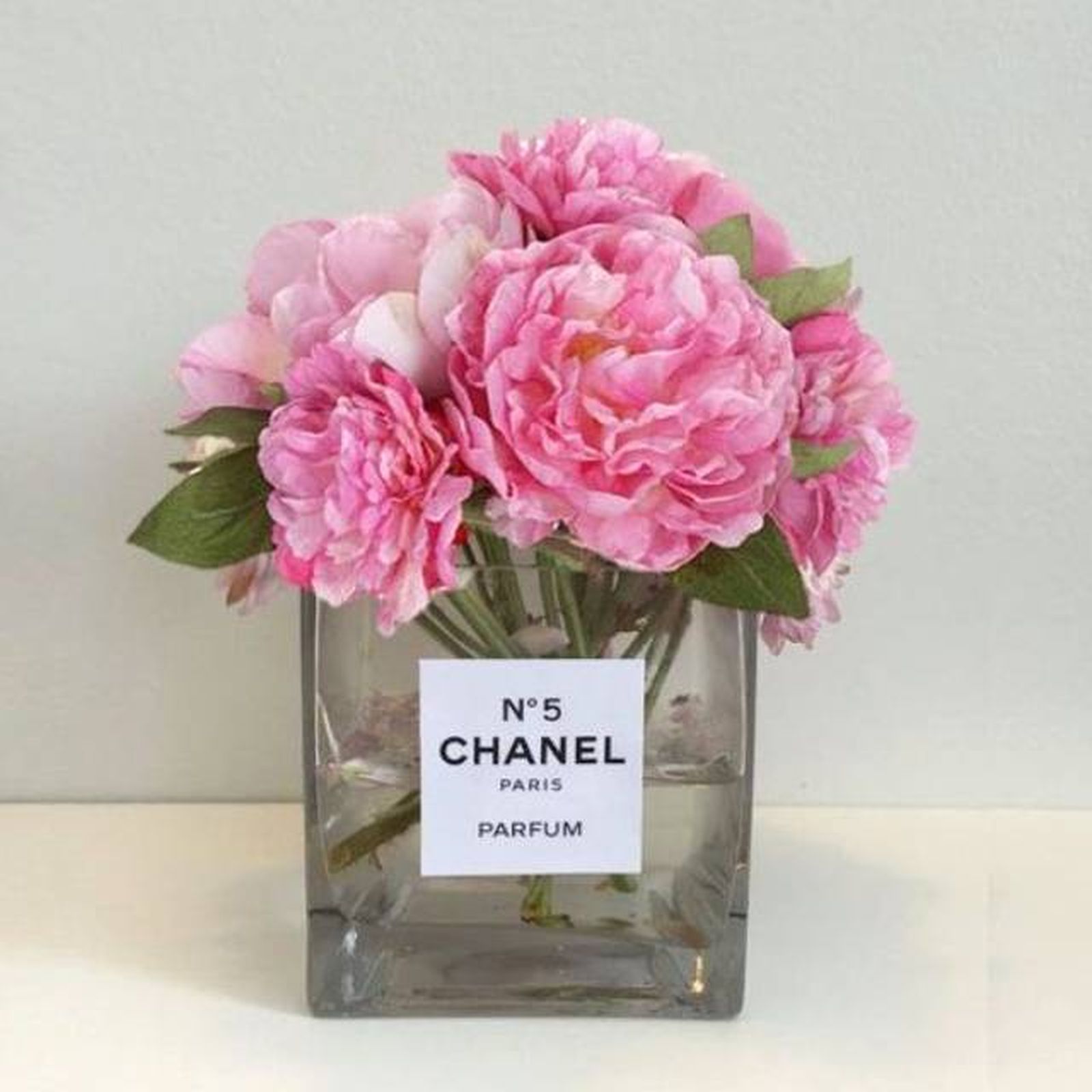perfume jarron flores