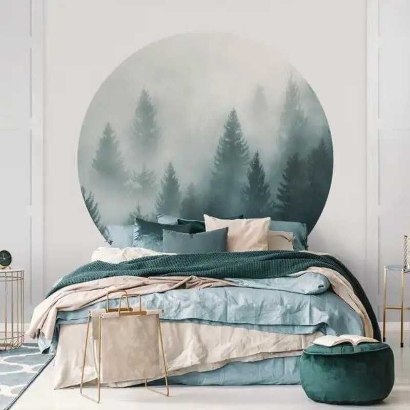 Dormitorio con vinilo redondo con estampado de paisaje.