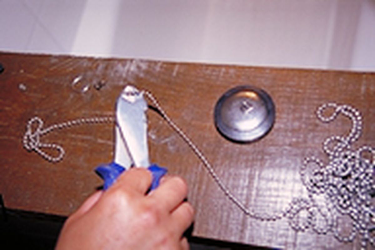 Sustitución de cadena y tapón de desagüe paso 1