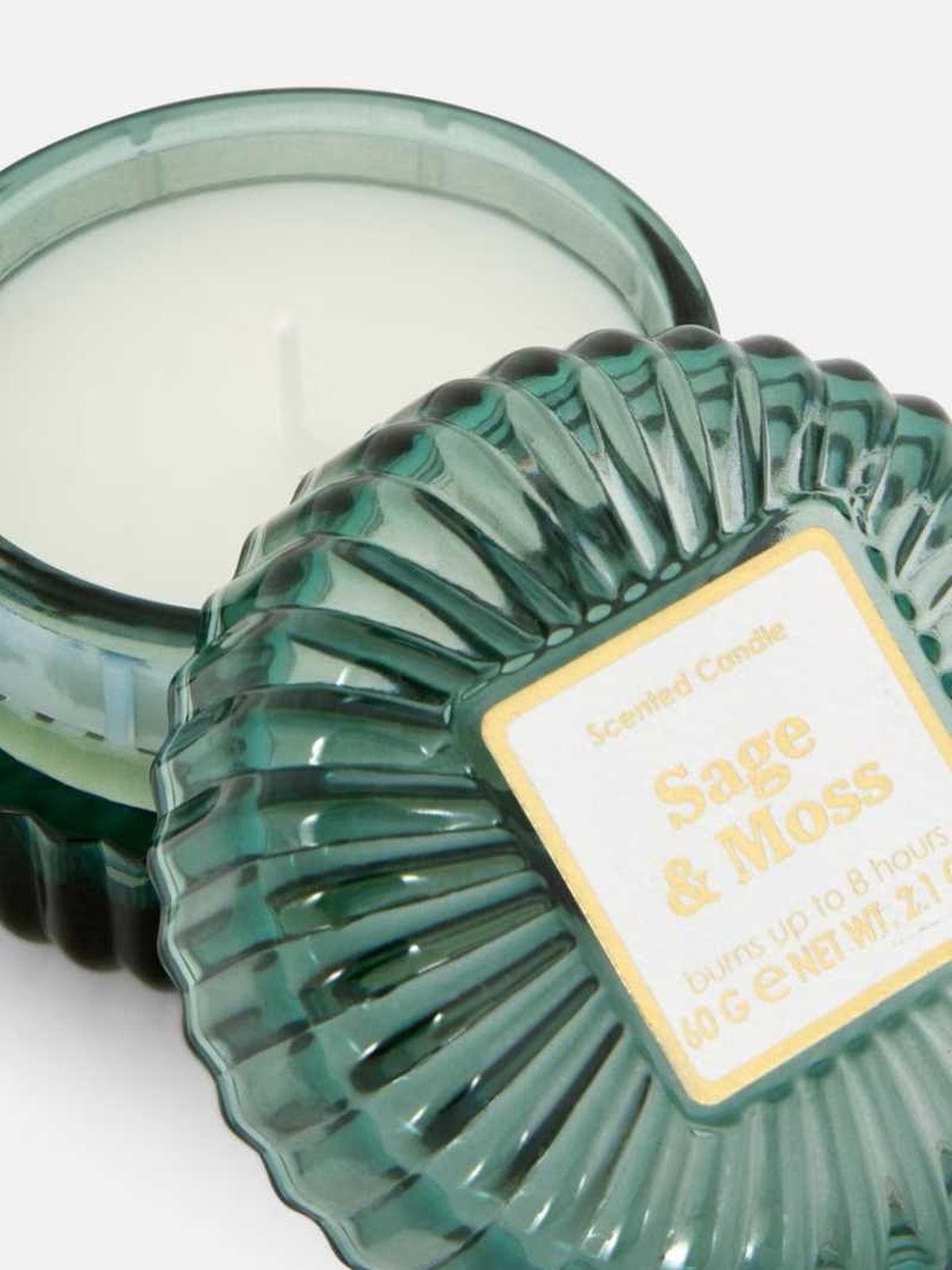 Vela con tarro de cristal azul turquesa.