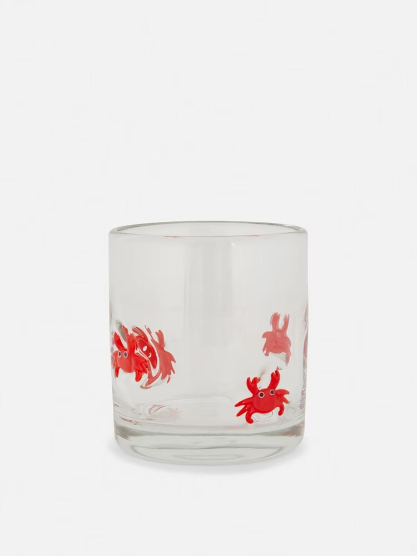 Vaso de vidrio con cangrejos en relieve.