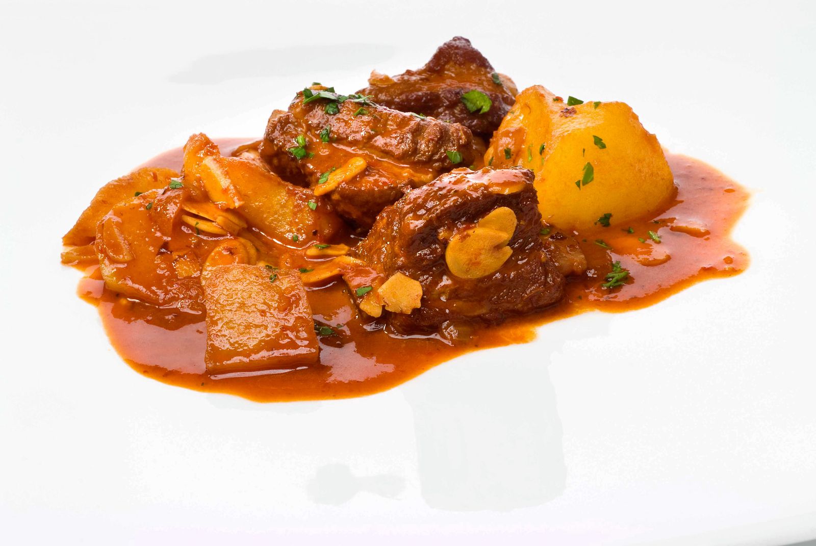 Costilla guisada con choriceros y zumo de naranja