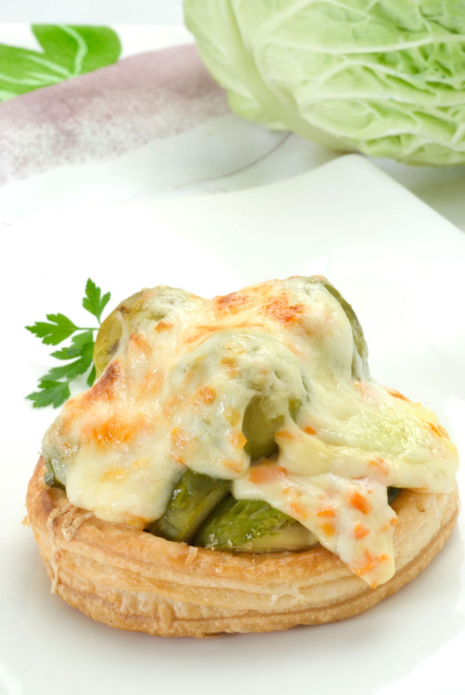 Coles de Bruselas gratinadas con queso