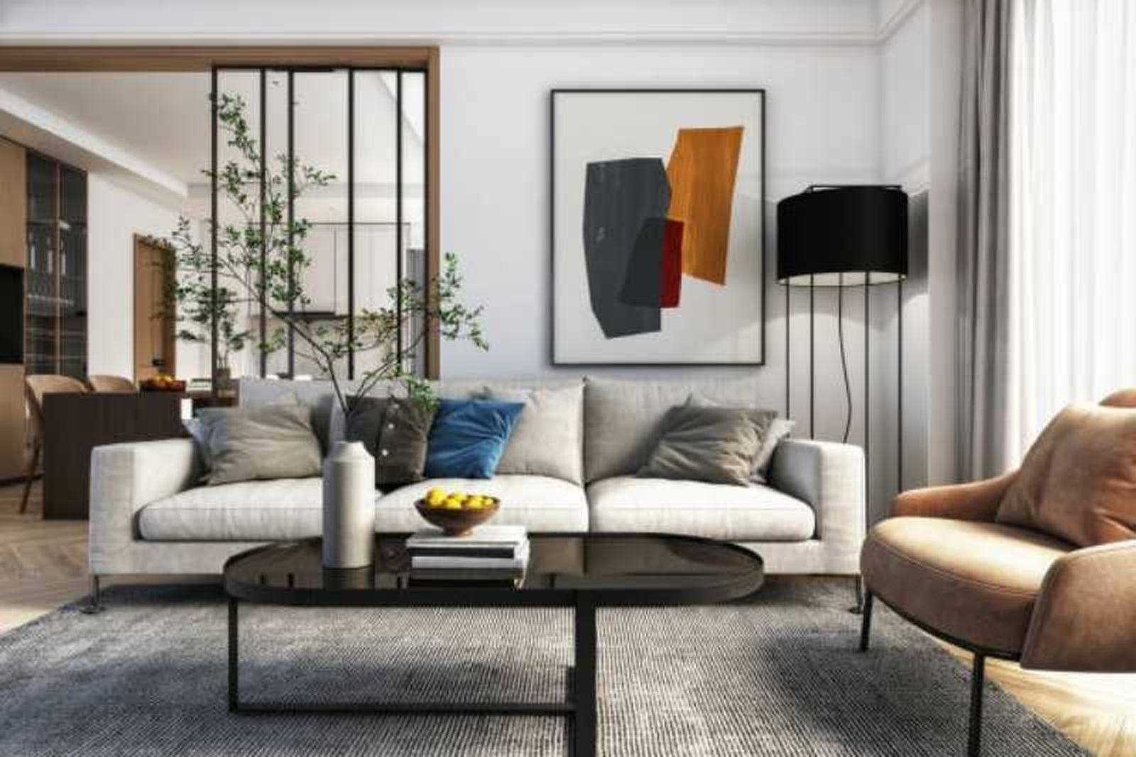 Salón moderno y elegante con decoración en beige y un cuadro abstracto.