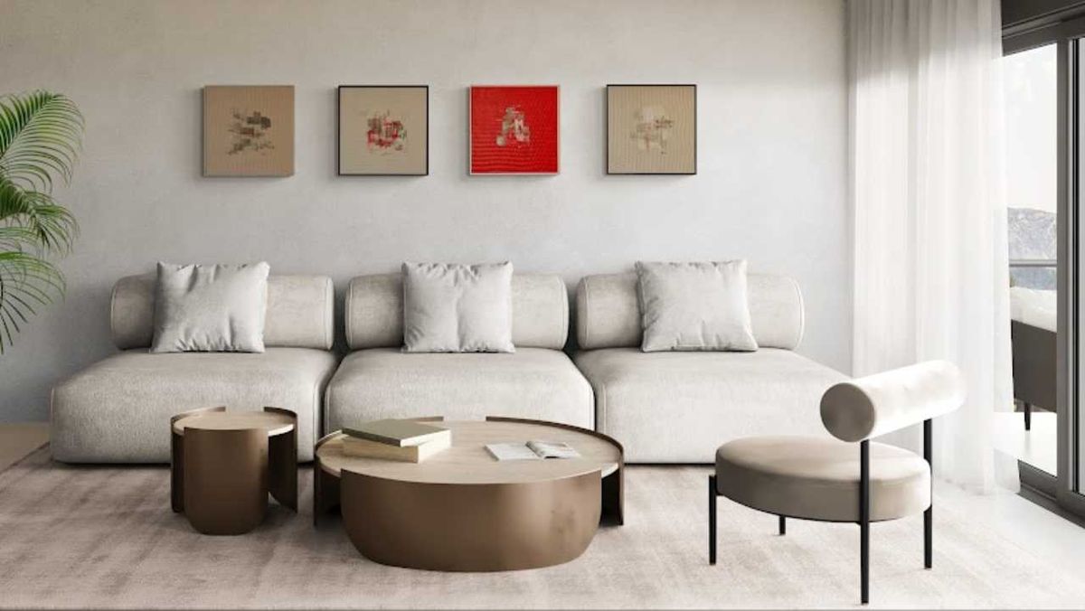 Salón decorado con tres cuadros tipo tablilla.