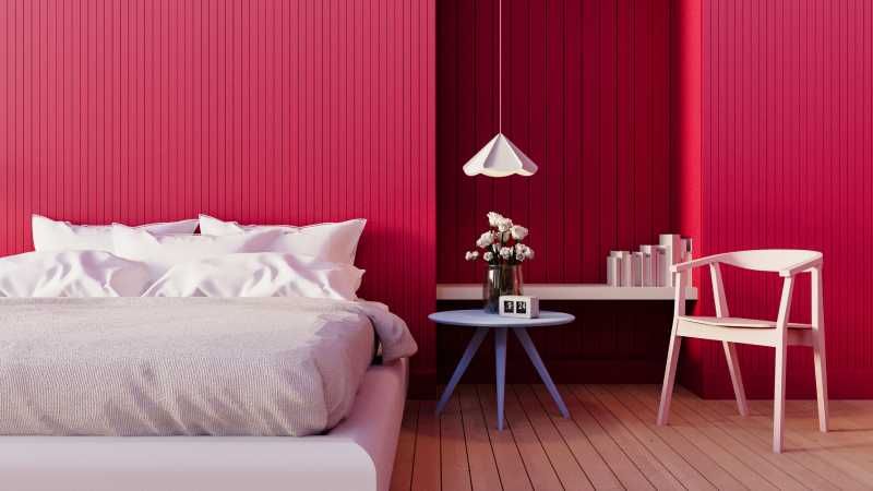 Dormitorio con pared rosa frambuesa.