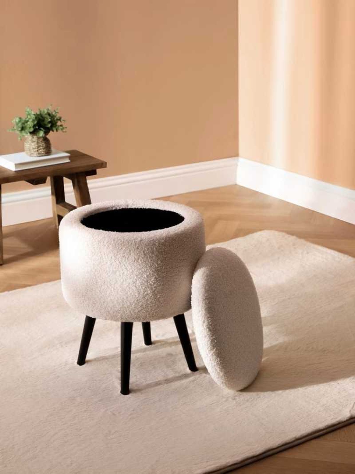 Taburete almacenamiento bouclé.