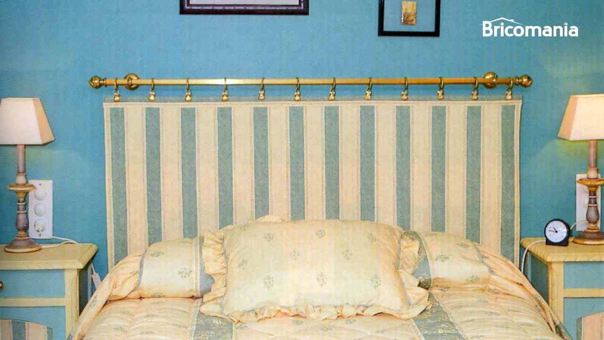 Cabecero de cama con una barra de cortina