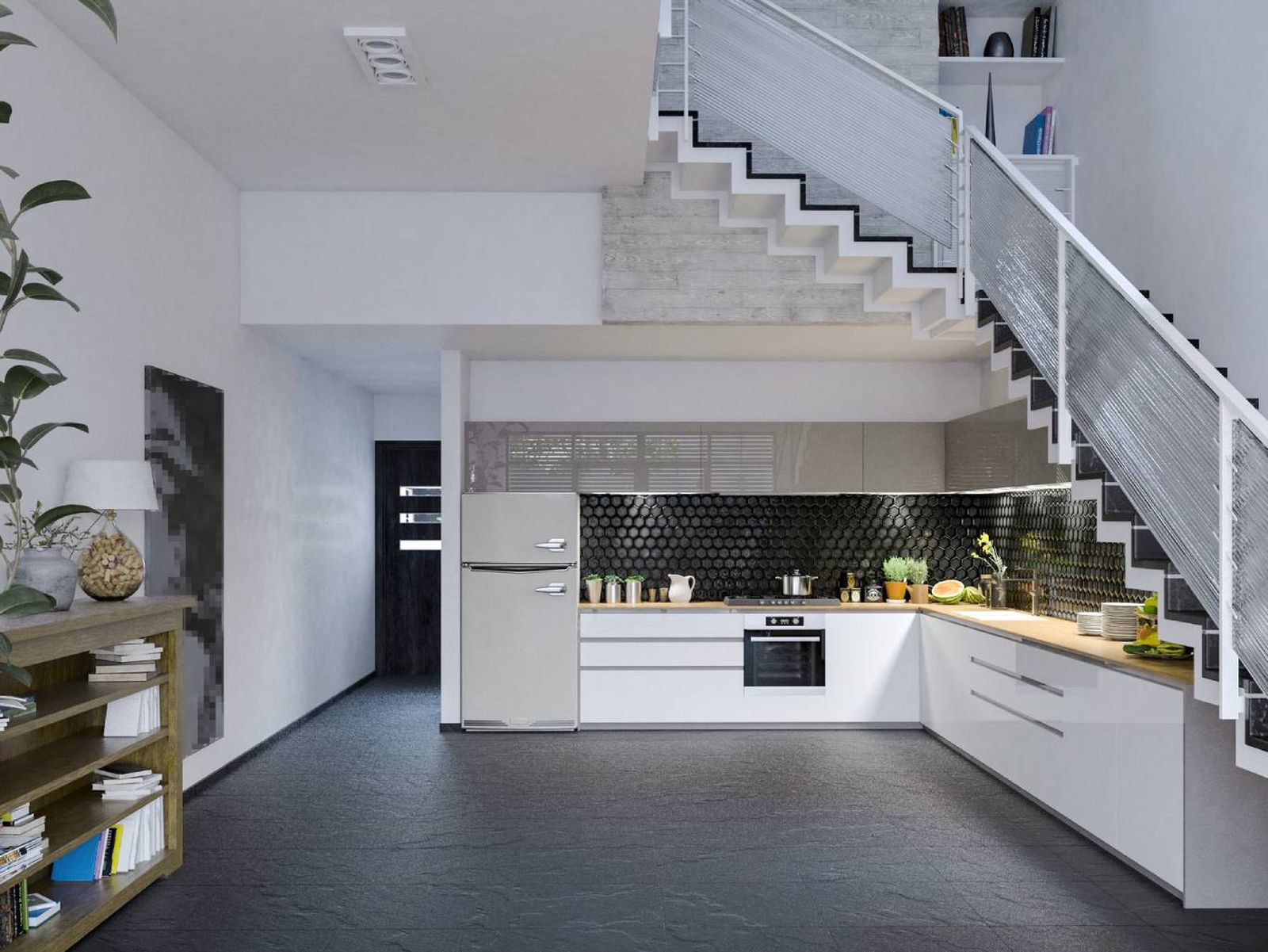 Un ejemplo perfecto de cómo integrar una cocina en el hueco de una escalera.