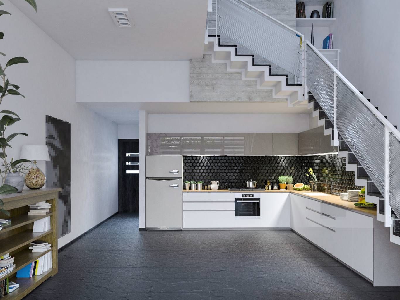 Un ejemplo perfecto de cómo integrar una cocina en el hueco de una escalera.