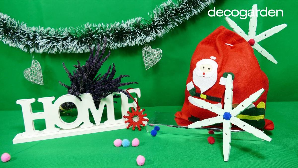 Estrella de Navidad hecha con pinzas de madera.