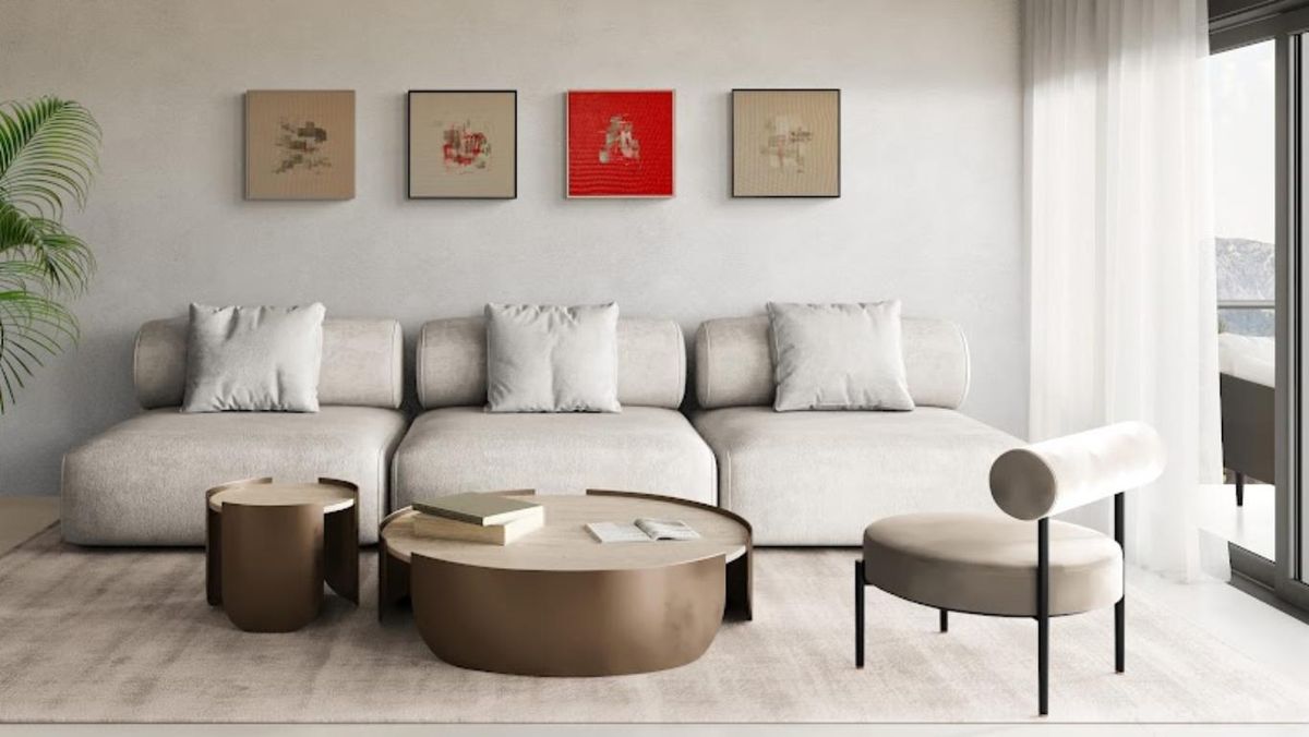 Salón con conjunto de tablillas abstractas encima del sofá. / Obras: Lola Castillejos