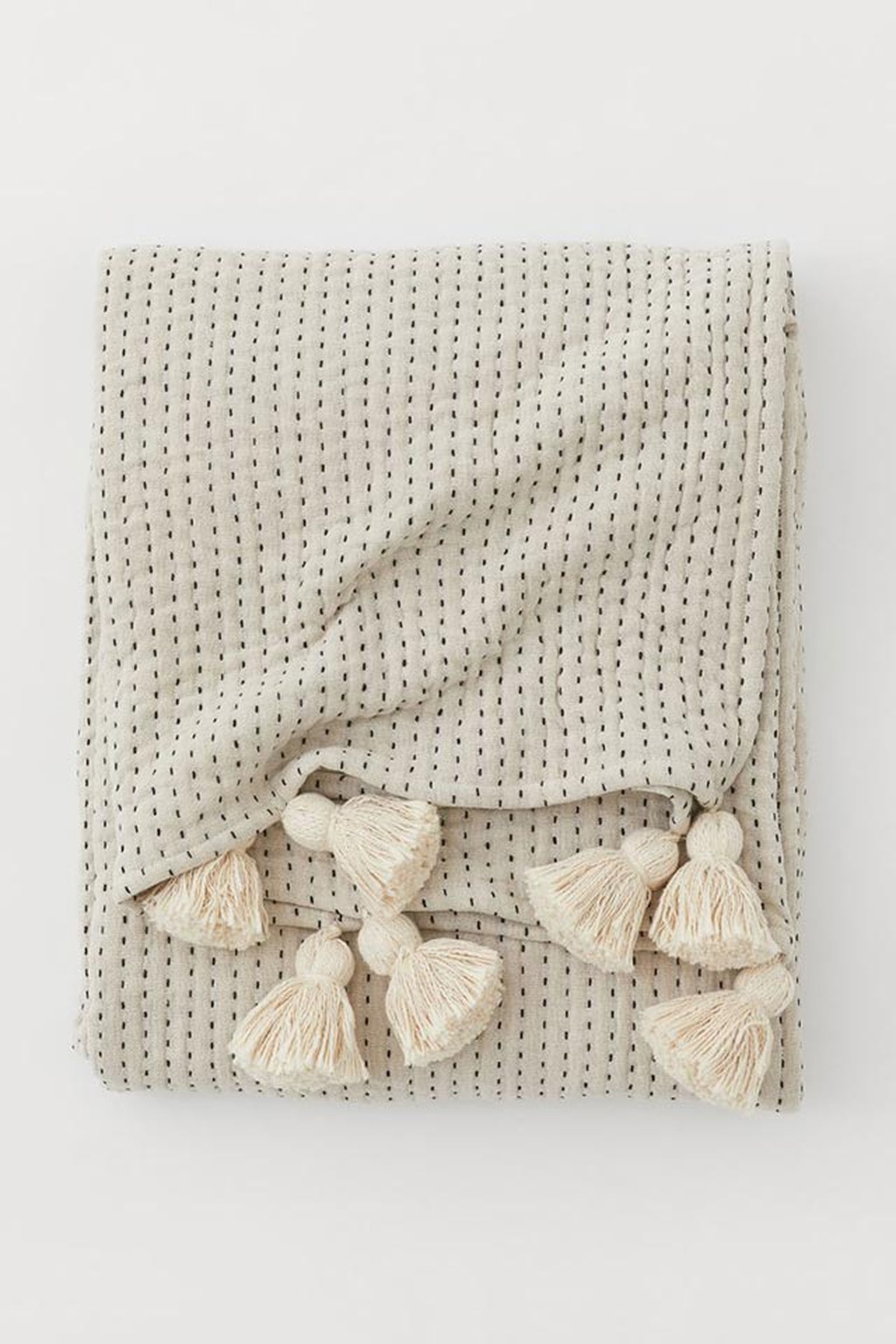 cubrecama con borlas h&m home