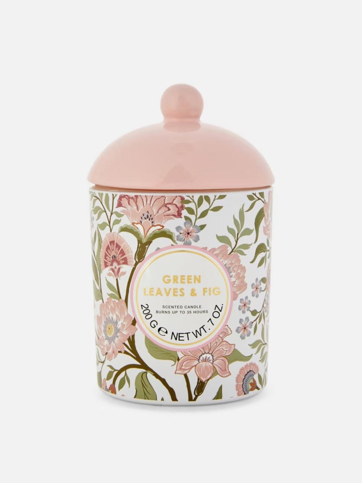 Vela con tapa y estampado floral.