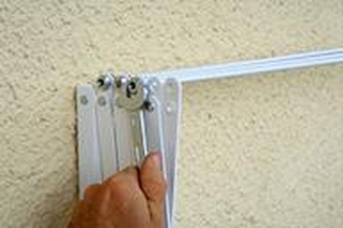 Colocar un tendedero de ropa extensible paso 3