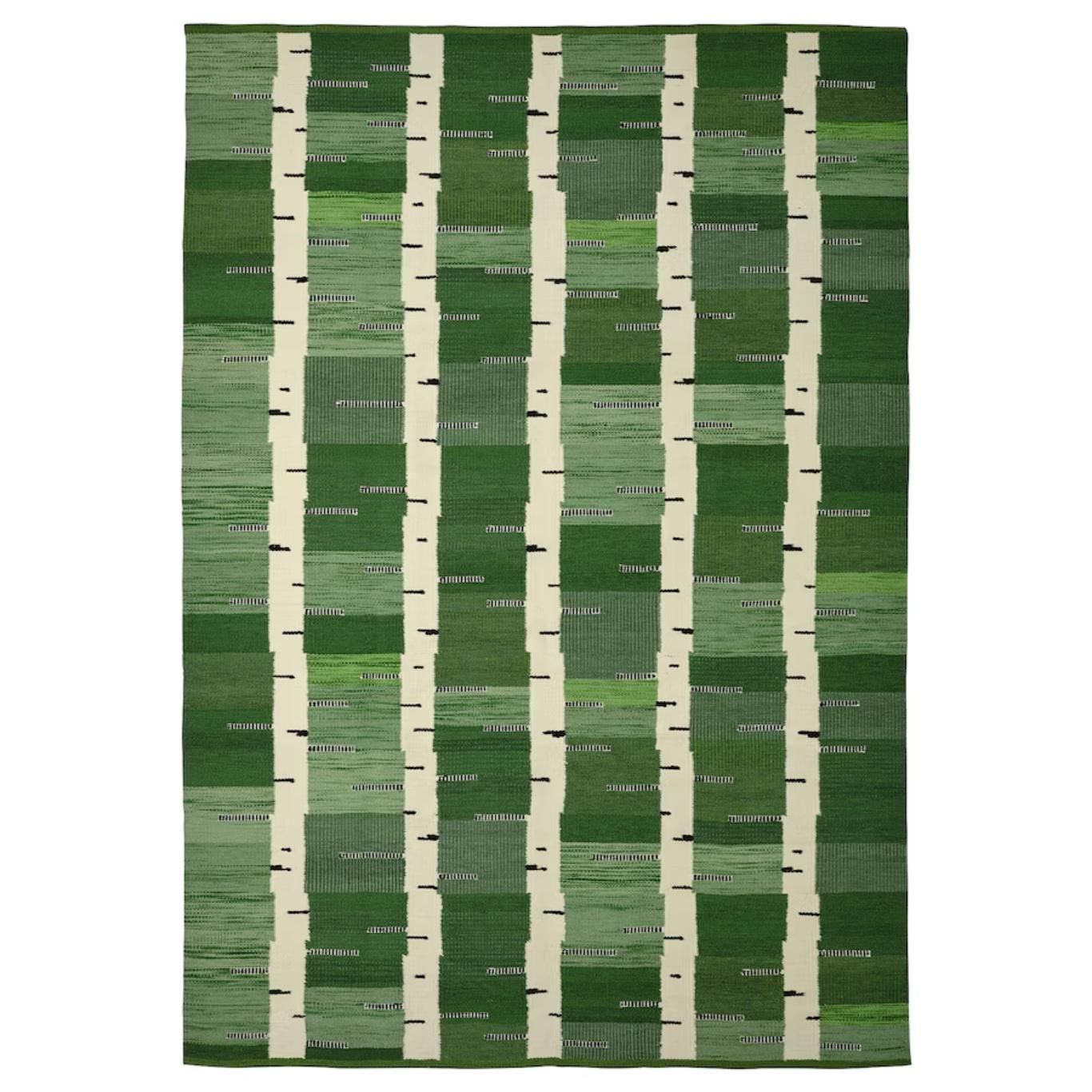 Alfombra verde tejida a mano de la colección actual.