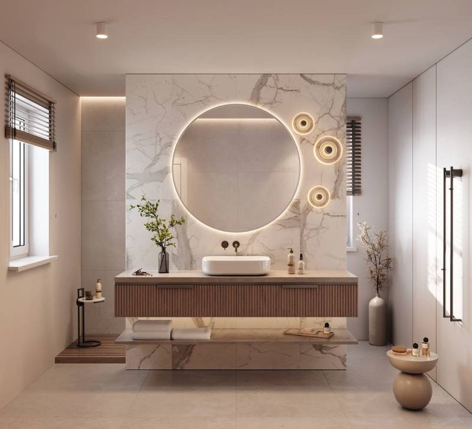 Baño de estilo minimalista con encimera de mármol, espejo redondo y una planta.