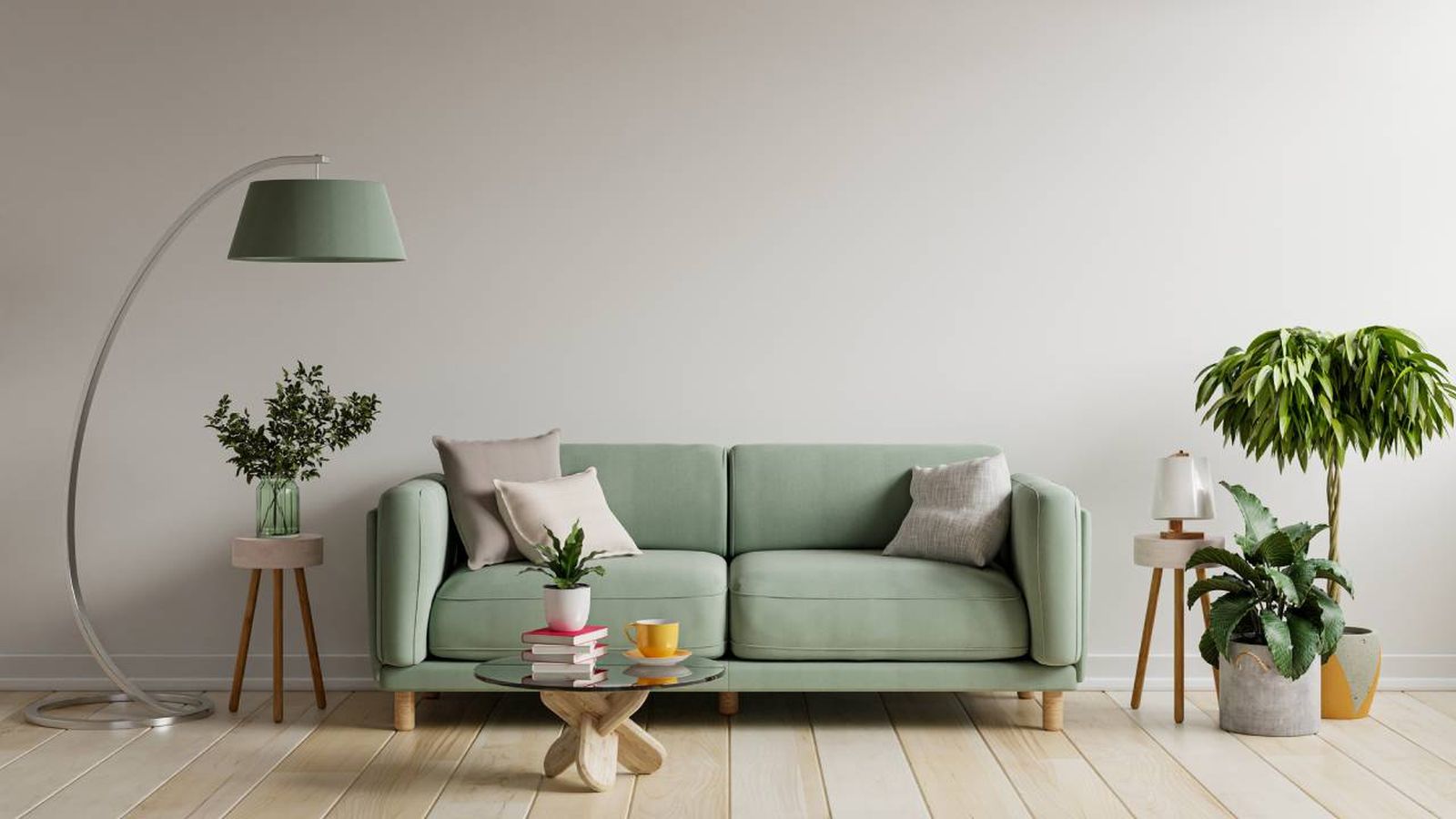 Salón de estilo minimalista con sofá verde.