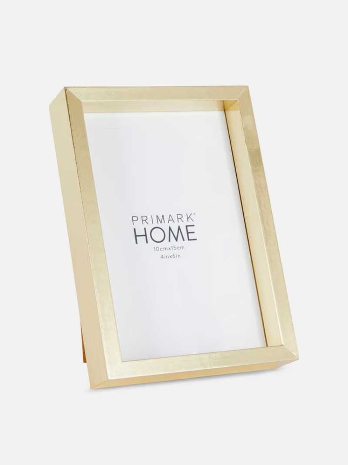 Marco de fotos de sobremesa dorado.