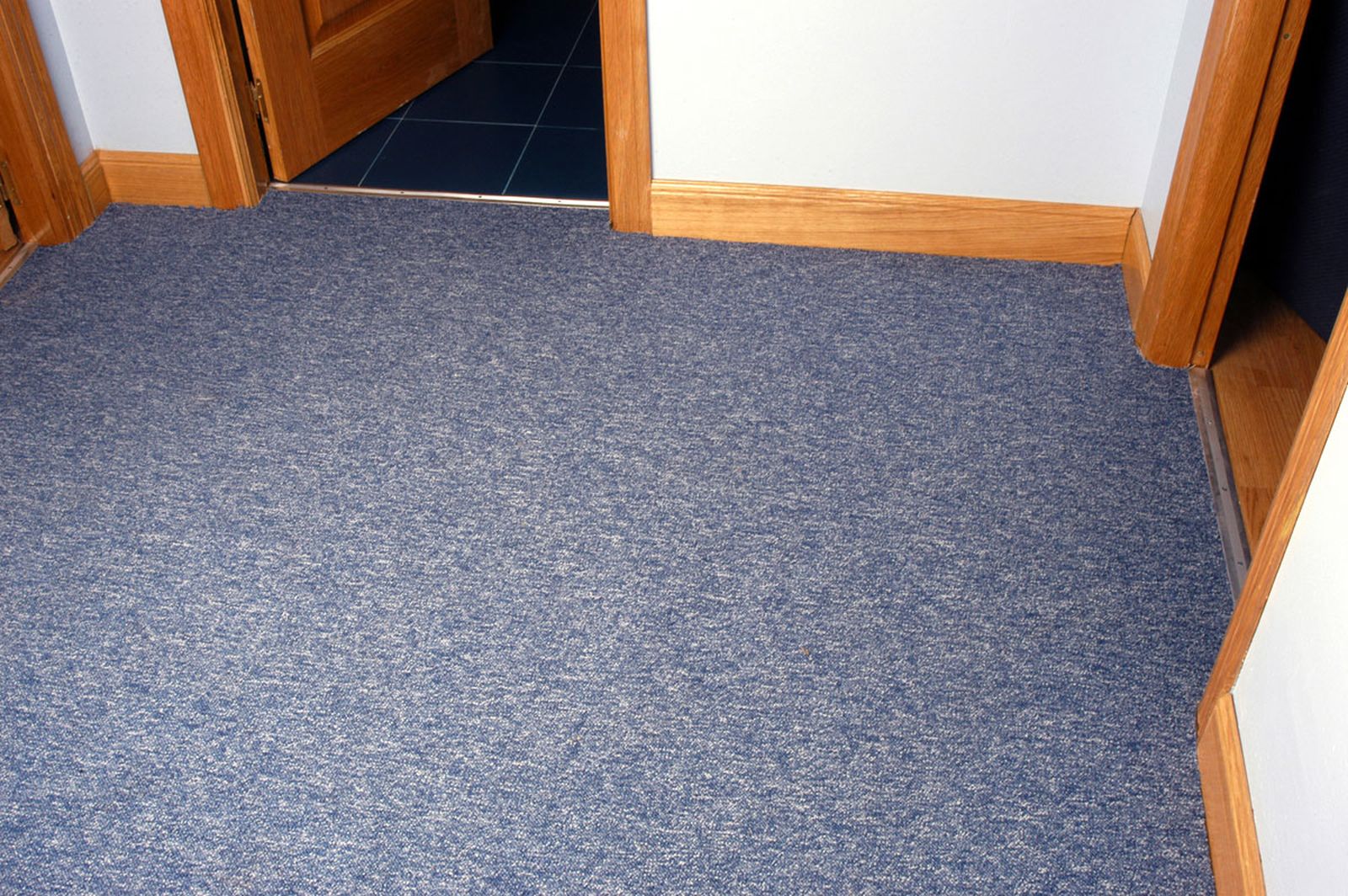 Enmoquetar el recibidor